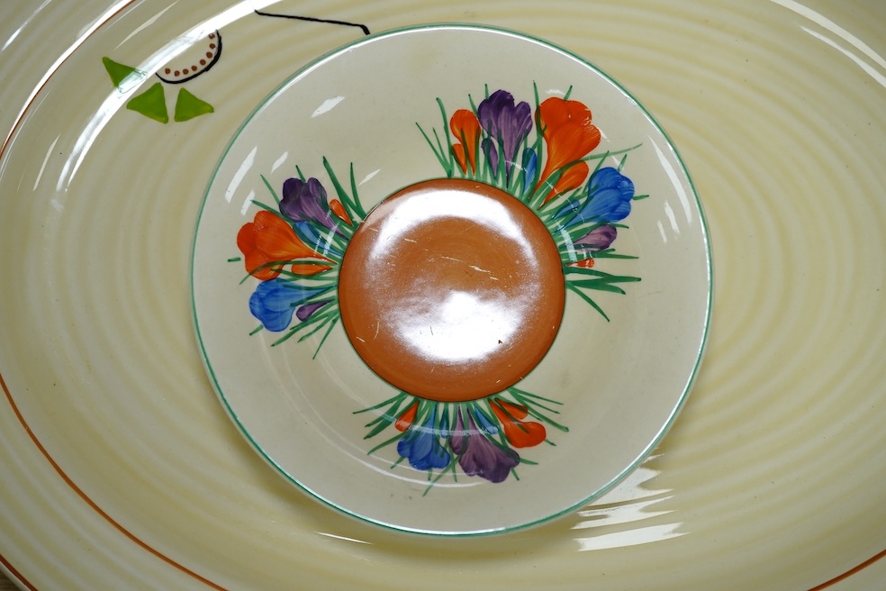 A Clarice Cliff Newport Pottery part tea set, an oval Clarice Cliff Bizarre meat platter Wilkinson Ltd and a similar Royal Staffordshire, Wilkinson Ltd part dinner service and a Clarice Cliff Crocus bowl, meat platter 41